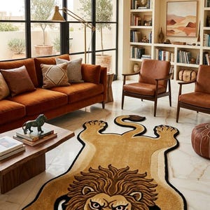 May include: A living room featuring a large, tan lion-shaped rug with a black border. The room includes a rust-colored velvet sofa, leather chairs, and a wooden coffee table. Bookshelves and large windows complete the scene.