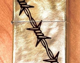Zippo personalizado con alambre de púas