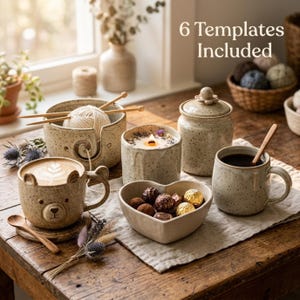 Pode incluir: Um conjunto de itens de cerâmica salpicada, incluindo uma tigela de lã com agulhas de tricô, uma caneca em forma de urso com latte art, uma tigela em forma de coração com chocolates, um pote com tampa e uma caneca com uma colher de madeira.