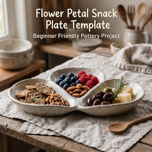 May include: A speckled ceramic flower petal snack plate filled with crackers, nuts, berries, olives, and cheese. The plate is on a linen tablecloth. Text on the image reads: "Flower Petal Snack Plate Template" and "Beginner Friendly Pottery Project."