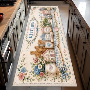May include: A rectangular kitchen runner rug featuring a cream background with a floral border, blue gingham accents, and illustrations of kitchen canisters labeled Flour and Sugar, wooden spoons, a rolling pin, and a pitcher with flowers.