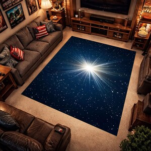 May include: A large rectangular area rug with a deep blue background and a bright white starburst design. The rug is placed in a living room setting, surrounded by furniture and decor.