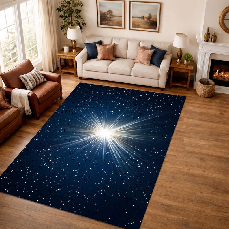 May include: A rectangular area rug with a celestial design. The rug features a dark blue background with a bright white starburst pattern in the center and scattered white dots resembling stars.