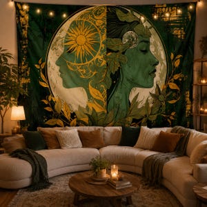 May include: A large rectangular wall tapestry featuring a split-face design in shades of dark green and gold. One side depicts a sun motif, while the other shows a profile adorned with leaves and a moon. The artwork is framed by a circular border.