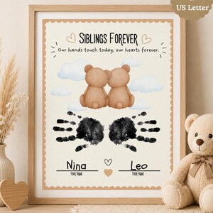 May include: Framed print with the text "SIBLINGS FOREVER" and the phrase "Our hands touch today, our hearts forever." Features two teddy bears, two handprints, and space for names. Includes A4 & US Letter size options.