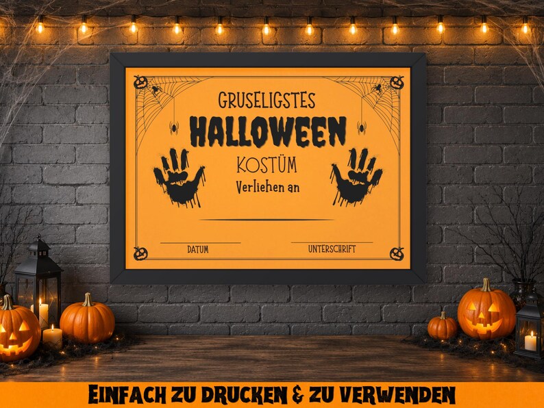 May include: A framed orange Halloween costume award certificate with black text and handprints. The certificate is decorated with spiderwebs and pumpkins. The background includes pumpkins, candles, and string lights.