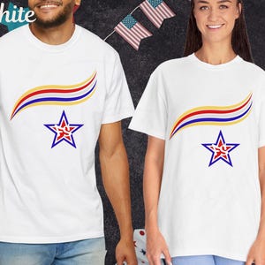 May include: White t-shirts with a patriotic design. Each shirt features a curved design in red, yellow, and blue above a blue star with a red center. The word "White" is visible in the upper left corner.