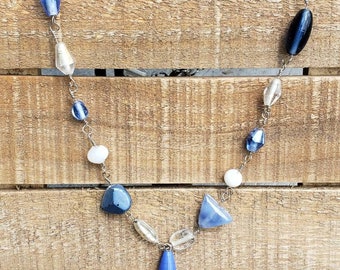 Handcrafted blue glass bead necklace with green teardrop