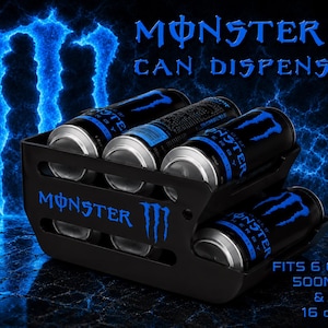 May include: A black Monster can dispenser featuring the blue Monster logo and text. The unit holds six cans, with text stating it fits 500ml and 16 oz cans. The dispenser has a tiered design with cutouts, displaying black and blue energy drink cans.