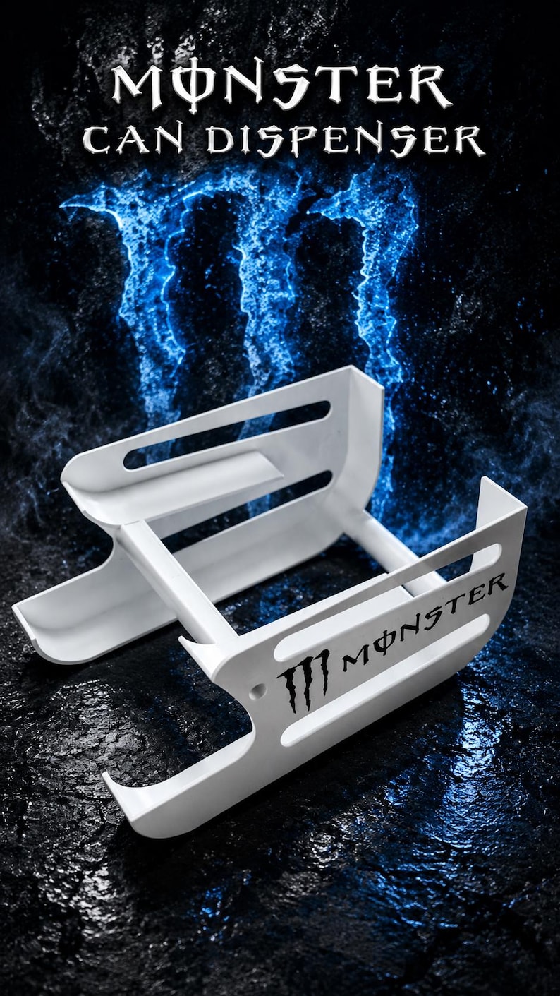 May include: A white plastic can dispenser featuring the Monster logo and text on the side. The structure consists of two parallel rails with horizontal slots, designed to hold beverage cans in a horizontal position for organized storage.