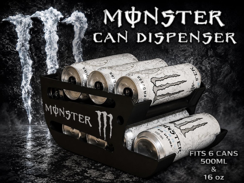 May include: A black Monster can dispenser featuring the Monster logo and text. The unit holds six cans, with white Monster Ultra cans visible inside. Text on the dispenser reads Monster Can Dispenser, Fits 6 Cans, 500ml & 16 oz. The design is open-sided.