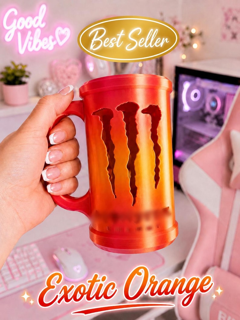 May include: A cylindrical orange and red gradient mug featuring a vertical cutout design of three claw marks on the front. The mug has a sturdy handle on the side and a smooth, solid base. The surface displays a vibrant, warm color transition.