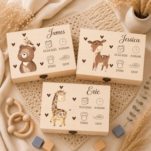 May include: Three wooden keepsake boxes, each personalised with a name, date, time, weight (3700g), and length (52cm). Illustrations include a bear, deer, and giraffe. The boxes are decorated with hearts.