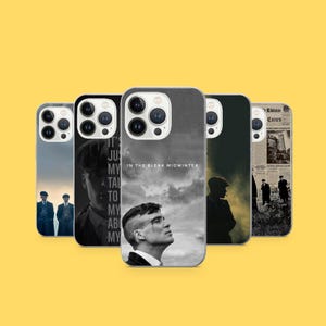 May include: Five phone cases with different designs. The cases display images of characters and scenes, with text including "IN THE BLEAK MIDWINTER" and "Elnass Cunes". The cases are predominantly grey, black, and white.