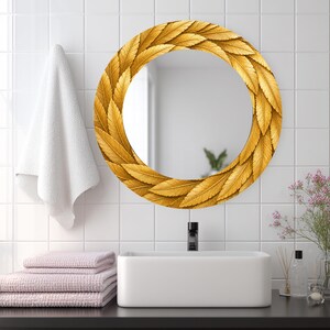 May include: A round wall mirror featuring a decorative frame composed of overlapping golden yellow leaves. The mirror surface is reflective and circular, displaying a clear view of the surrounding environment within its polished glass center.