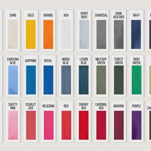 May include: A color chart featuring rectangular swatches in various shades. The chart includes colors like white, black, navy, red, and green, with labels such as "White," "Navy," and "Red." The color swatches are arranged in rows and columns.