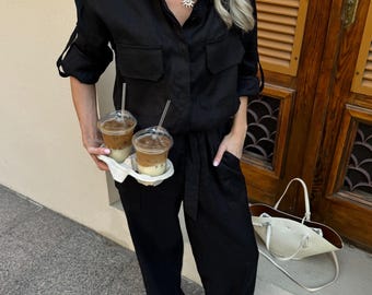 Macacão preto de linho feminino, peça única em linho natural com modelagem solta, look chique para o verão.