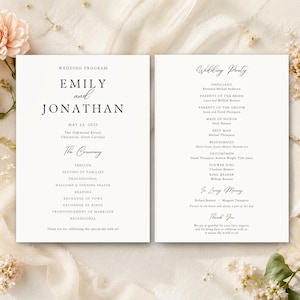 May include: Two white wedding programme cards with black serif and script text. The left card displays the names Emily and Jonathan, date, location, and ceremony order. The right card lists the wedding party, in loving memory, and thank you note.