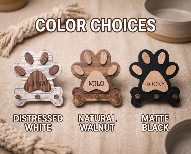 Puede incluir: Tres ganchos de pared de madera con forma de pata, base en forma de hueso y tres peque&ntilde;os ganchos met&aacute;licos cada uno. El de la izquierda es blanco desgastado con el nombre LUNA, el central es de nogal natural con MILO y el derecho es negro mate con ROCKY.