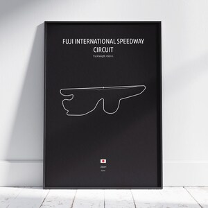 May include: Black framed poster featuring the Fuji International Speedway Circuit track layout in white. The text "FUJI INTERNATIONAL SPEEDWAY CIRCUIT" is at the top, with track length 4563 m. The Japanese flag and "Japan" are at the bottom.