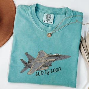 Comfort Colors F-15 Fighter Jet Shirt, God Is Good Pilot Tribute Tee, Vintage Military Aviation Faith Shirt, F15 Eagle Aesthetic Mom Gift immagine 1