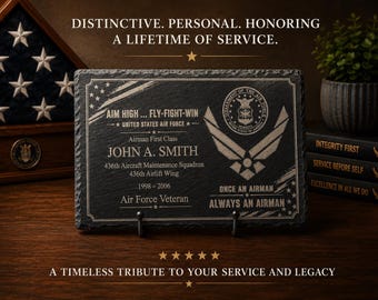 May include: A rectangular black slate plaque engraved with United States Air Force insignia, the text AIM HIGH... FLY-FIGHT-WIN, JOHN A. SMITH, 436th Aircraft Maintenance Squadron, 436th Airlift Wing, 1998-2006, AIR FORCE VETERAN, and ONCE AN AIRMAN, ALWAYS AN AIRMAN.