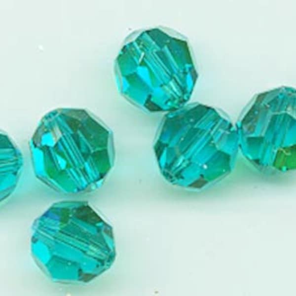 Twelve Swarovski crystals: art 5000 - 8 mm - blue zircon AB