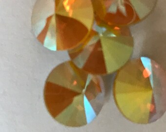 Eight beautiful Swarovski rivoli stones - art 1122 - 12 mm - yellow opal