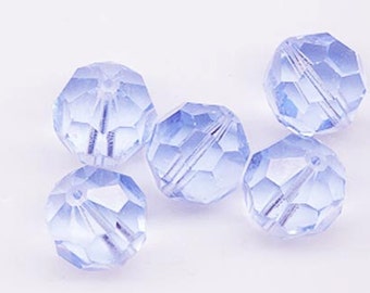 May include: Five light blue faceted glass beads. The beads are round and have a smooth, shiny finish.