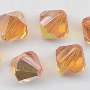 Eight vintage Swarovski crystal beads - Art. 364/5301 - 12mm - sun AB