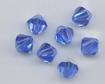 Eight  vintage Swarovski crystal beads - Art. 364/5301 - 12 mm - sapphire AB