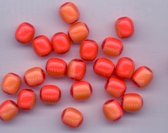 May include: A collection of 20 small, round, translucent beads. The beads are a mix of orange and red colors, with a slight shimmer.