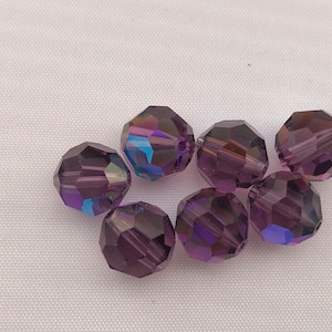 Twelve vintage Swarovski crystal beads in the non-standard color lilac AB - Art. 5000 - 8mm
