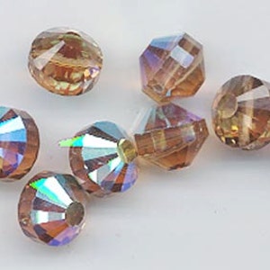 8 vintage Swarovski crystal beads -- rare style art. 349/5101 - 10mm - light smoked topaz AB