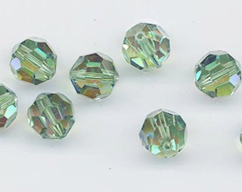 Twelve Swarovski crystals: art 5000 - 8 mm - erinite AB