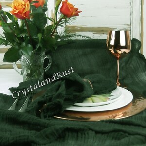 May include: A dark green linen table runner with a copper charger plate, a white plate, and a copper wine glass. The table runner is textured and has a subtle sheen. The text "CrystalandRust" is visible in the image. The website address "www.crystalandrust.etsy.com" is also visible.
