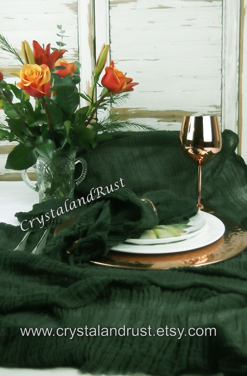 May include: A dark green linen table runner with a copper charger plate, a white plate, and a copper wine glass. The table runner is textured and has a subtle sheen. The text "CrystalandRust" is visible in the image. The website address "www.crystalandrust.etsy.com" is also visible.