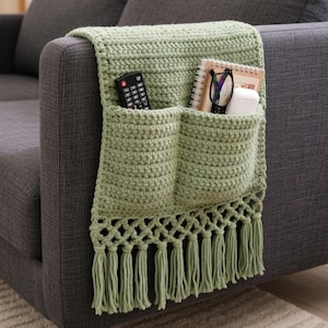 May include: A set of three ceramic mugs with a speckled, matte finish. The mugs are in shades of cream, light gray, and dark gray. Each mug has a simple, minimalist design, perfect for coffee or tea.