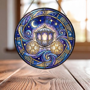 May include: Round stained glass window featuring a fairytale carriage design in shades of blue, purple, and gold. The design includes a crescent moon, stars, and Roman numerals around the edge, with a black metal frame and hanging chain.