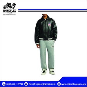 May include: A black leather bomber jacket with a front zip, a collar, and striped ribbed cuffs, worn with heather grey sweatpants featuring a small script logo on the left thigh and white trainers with black stripes and laces.
