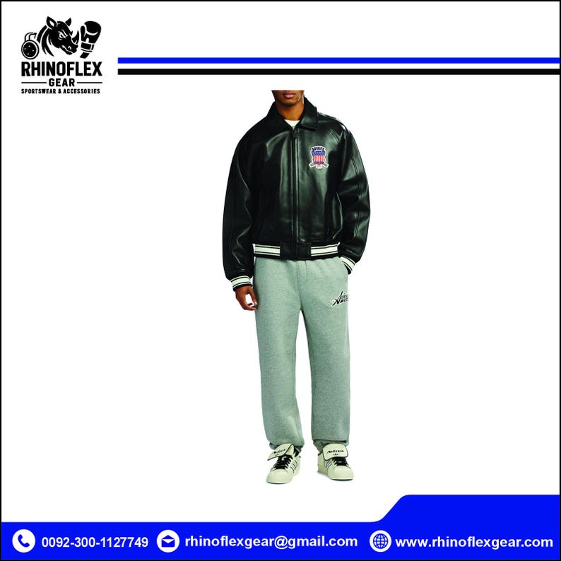 May include: A black leather bomber jacket with a front zip, a collar, and striped ribbed cuffs, worn with heather grey sweatpants featuring a small script logo on the left thigh and white trainers with black stripes and laces.