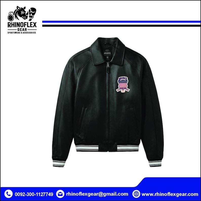 May include: A black leather jacket featuring a classic collar, a full-length front zip, and long sleeves. The jacket includes a colourful patch on the left chest displaying the text AVIREX with a shield design and a striped pattern in red, white, and blue.