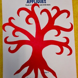 May include: Red felt applique of a stylized tree with a curved trunk and branches. The applique is ready to be ironed and stitched down. The text "Creations by Melodie" and "APPLIQUES" are at the top of the page. The text "Ready to iron and stitch down." is below the title. The text "abor $1000" is at the bottom of the page.