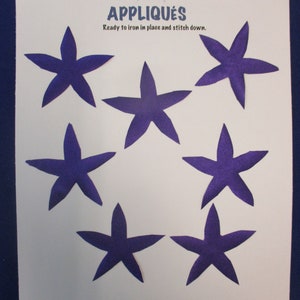 May include: Six purple felt star appliques, ready to iron on and stitch down. The appliques are perfect for adding a touch of whimsy to any project.