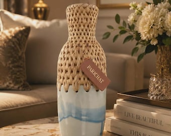 Tall white vase with blue stripes.