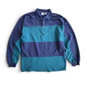 May include: A long-sleeve polo shirt featuring wide horizontal stripes in alternating shades of dark blue and teal. The garment has a classic collar, a buttoned placket with two visible buttons, and ribbed cuffs at the end of each sleeve.