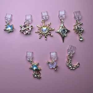 Celestial dust plug charms