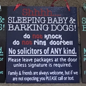 May include: Three wooden signs with the text "Shhhh... SLEEPING BABY & BARKING DOGS!" and other instructions. The signs are in black, navy blue, and brown, with white and teal lettering. Each sign has a decorative top.