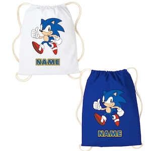 May include: Two drawstring bags, one white and one blue, each with a cartoon hedgehog character giving a thumbs-up. The character is blue with red shoes and white gloves. The word "NAME" is printed on each bag.