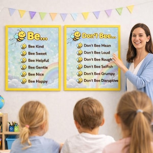 May include: Two framed posters with yellow borders, featuring bee-themed text. One says "Be..." with positive attributes like "Kind" and "Happy." The other says "Don't Bee..." with negative behaviours like "Mean" and "Grumpy." A teacher points to the posters.